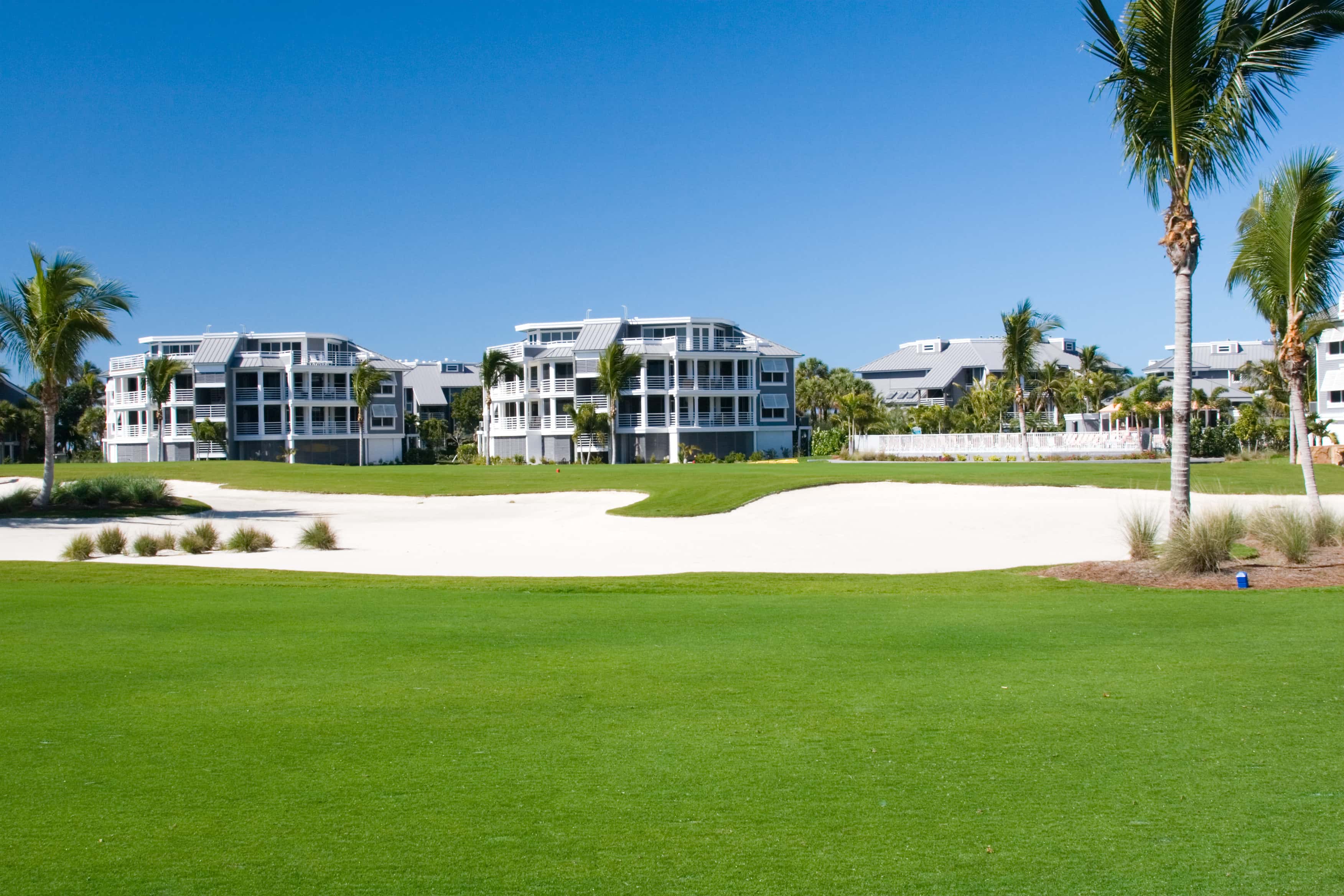 Golf course with condos behind